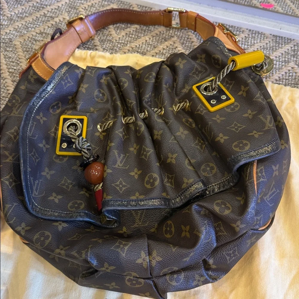 Louis Vuitton Brown Monogram Drawstring Shoulder Bag circa 2009